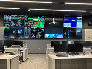 An image of the Chandra Operations Control Center (OCC), including large screens showing Chandra spacecraft information